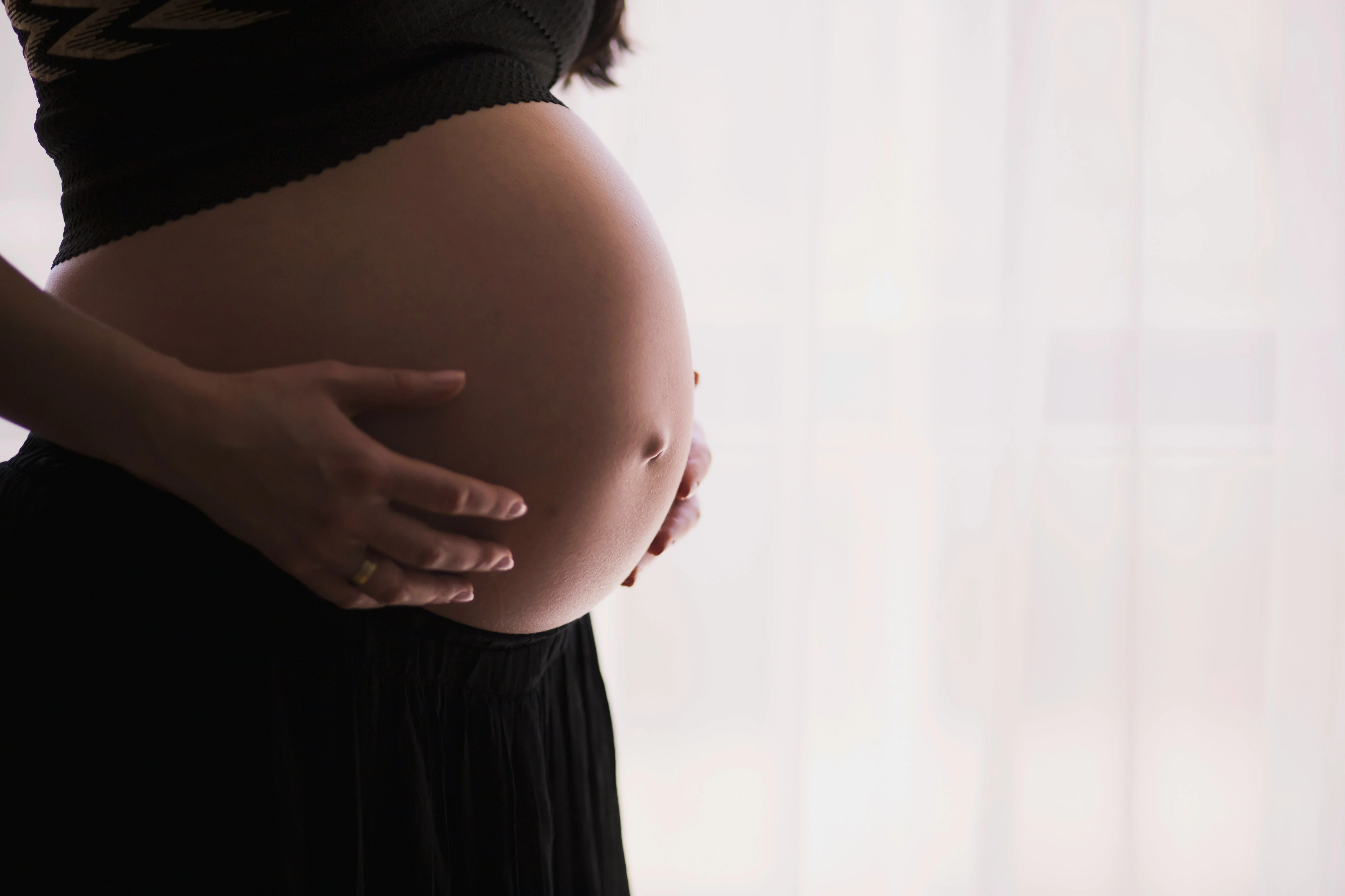 Pregnant belly with hands