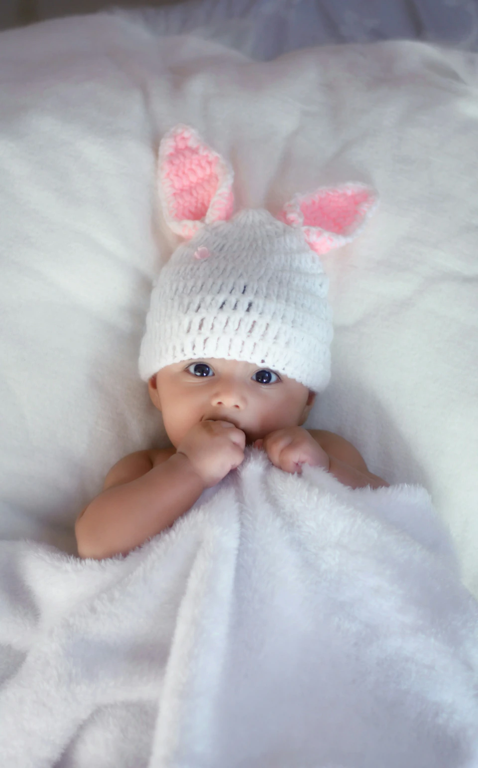 Baby with bunny ears hat