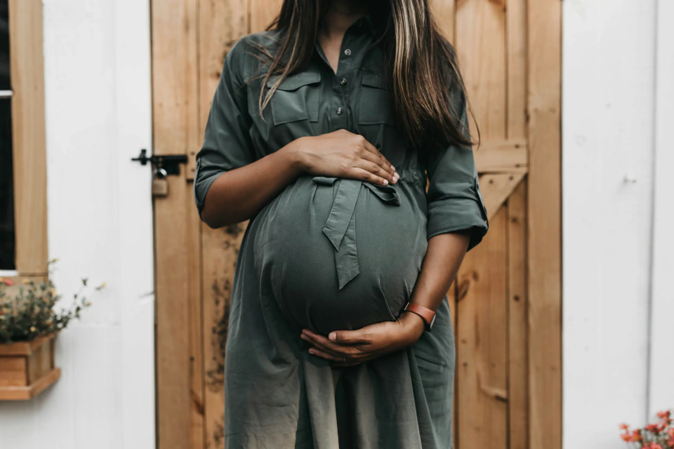 Pregnant woman in green dress